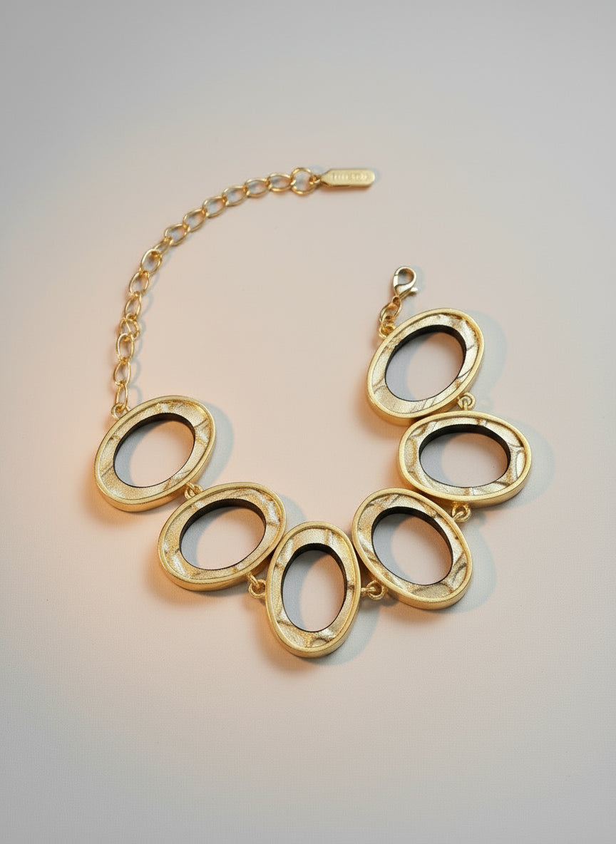 Gold leather bracelet, reversible with silver and gold textured leather, with gold plated casing